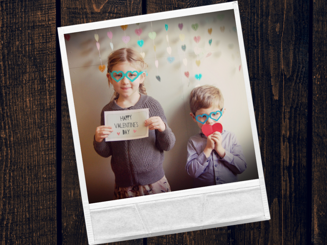 Polaroid photo of two kids wearing heart glasses