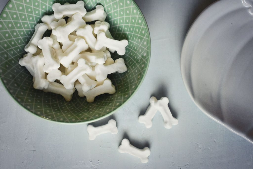 Candy bones in a green decorative dish
