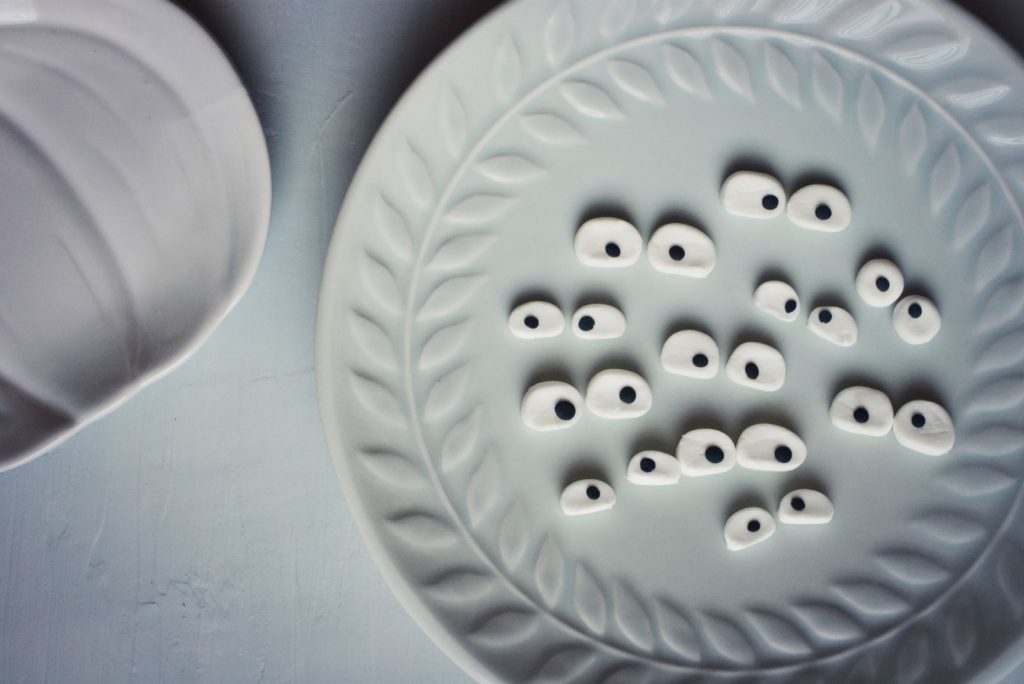 Candy eyeballs on a seafoam coloured plate
